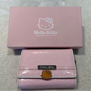 Hello Kitty wallet New-New. Pretty pink. Best Christmas gift for young lady